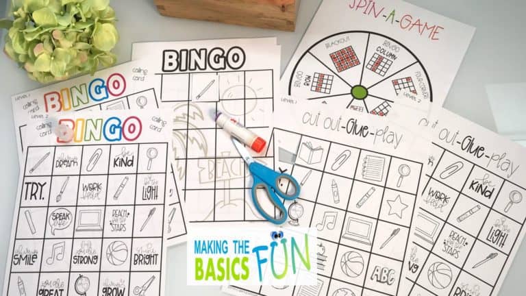 end of school year activity bingo set on a table, scissors and glue stick on top of papers