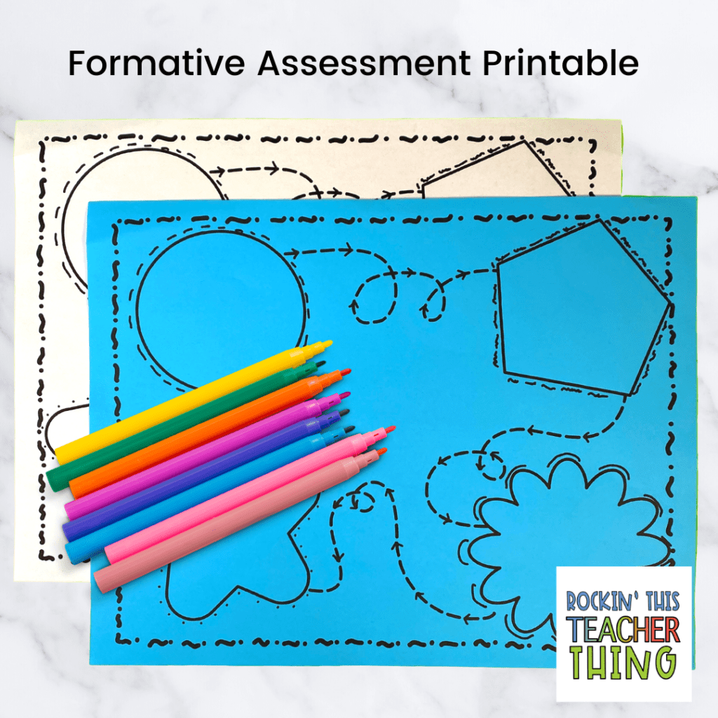 Picture of formative assessment printable. One on blue paper and one on white paper. Markers added on top