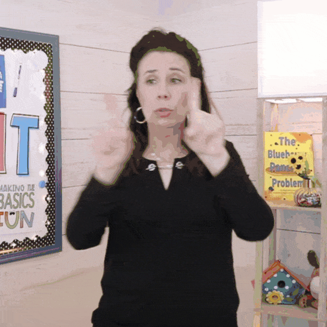 gif teacher holds hands infront with one finger up on one hand. she quickly taps the sides of her hands together to "magically" reveal that the hand now has two fingers up. She keeps tapping each time to reveal another finger.