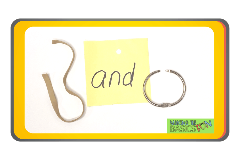 cut rubber band, sight-word and written on a yellow sticky note with a hole punched in the top and an open book ring