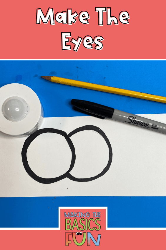 White paper with two connecting circles traced and outlined in black marker